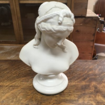 A marble bust of a Neo classical female.