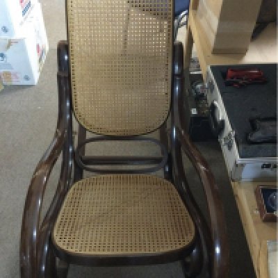 A bentwood style rocking chair with cane back and seat , no reserve