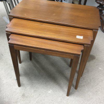 A nest of three mid 20th century design Teak tables on square tapering legs.