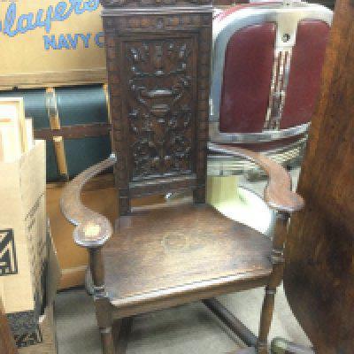 A carved oak chair. Shipping category D.