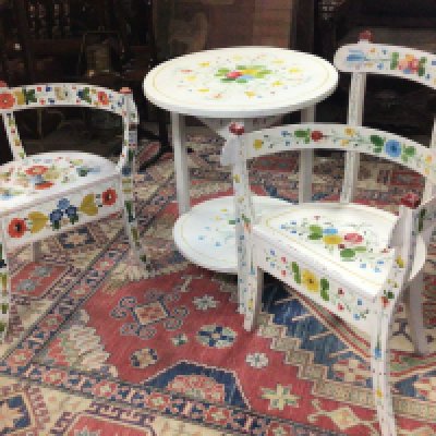 A Norwegian late 19th century or early 20th century hand painted folk art occasional table and two conforming chairs good condition in keeping with age (3)