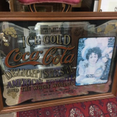 A large Coca Cola advertising mirror, approx 94cm x. 69cm. Shipping category D.