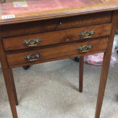 An Early 20th century walnut vertrine display cabinet with a hinged top above two drawers. on square tapering legs.