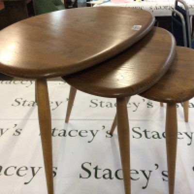 A nest of three mid 20th century Errol light colour Elm and beechwood pebble occasional tables.