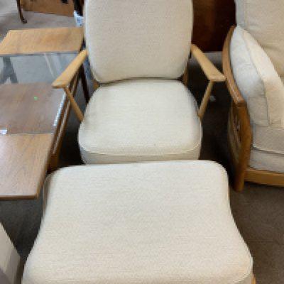 A pair of Ercol model 203 chairs and matching stools.