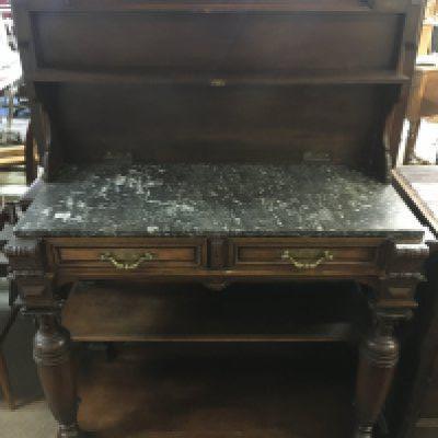 A French walnut buffet with a marble top.