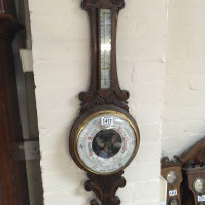 A Victorian carved oak Aneroid barometer with visible mechanism. Sold without reserve.