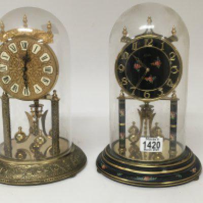 Two 20th century anniversary clocks under domes. Sold without reserve.