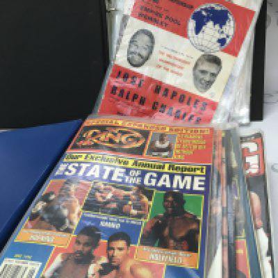 Two albums containing boxing programmes from the early 1970s and The Ring from the late 90s. Postage category b