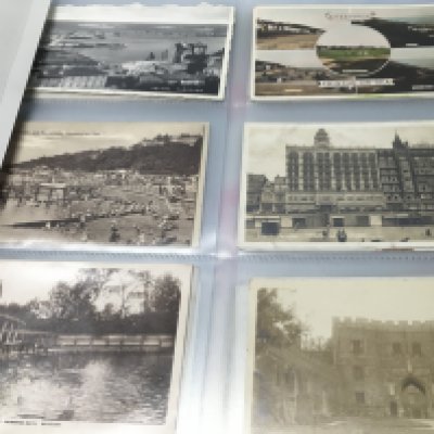 An album of vintage postcards . Postage category b