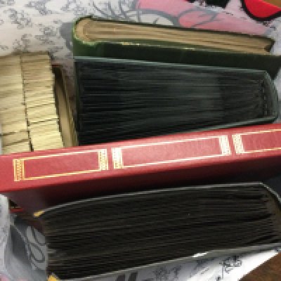 A bag containing postcard albums and a large quantity of cigarette cards including Players, Wills . Postage category c