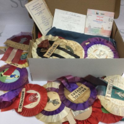 A box containing football memorabilia comprising rosettes, programs, a signed Stan Mortensen business card, tickets etc. Shipping category B.