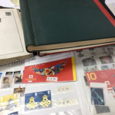 A collection of world and GB stamps together with Royal Family albums.