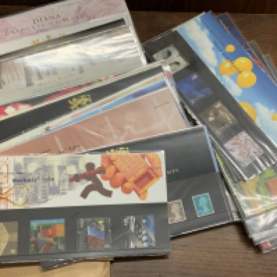 A large collection of presentation packs. (C)