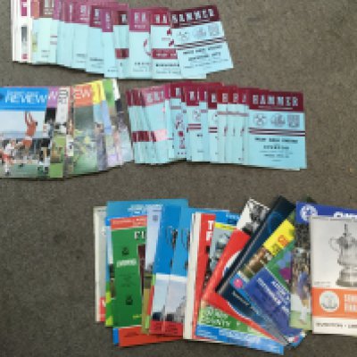 Two bags of football programmes.