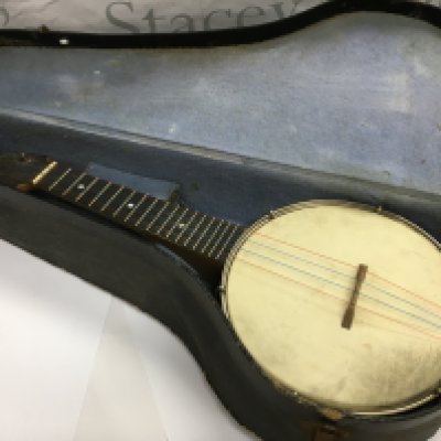A cased banjo.