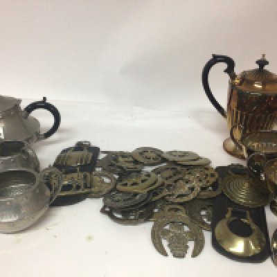 A collection of horse brasses including original 19th and 20 the century a pewter Arts and Crafts tea set a silver plated tea set and other oddments.