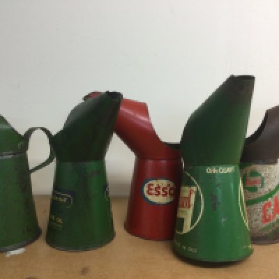 Five vintage oil jugs comprising Royal Snowdrift, Duckhams, Esso and other examples. Shipping category C.