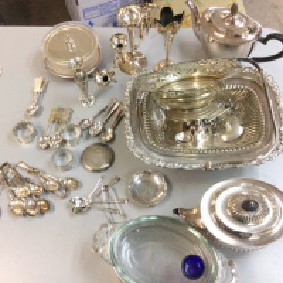 A collection of silver plated items including Chinese spoons and napkin rings , a small silver hallmarked flower shaped dish, cutlery, candelabra etc. this lot cannot be posted