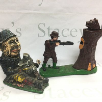 Two reproduction cast iron money boxes. Shipping category D. NO RESERVE