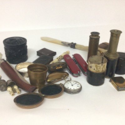 A collection of objects of virtue comprised two small telescopes a Victorian mother of pearl paper knife a silver fob watch Swiss folding knifes vesta cases and other oddments.