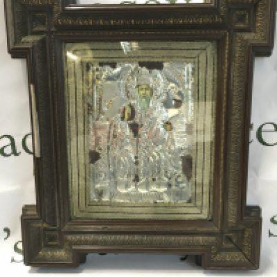 A framed Russian icon on wood, silver background. This lot cannot be posted in house