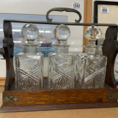 An oak 3 bottle tantalus. (D)