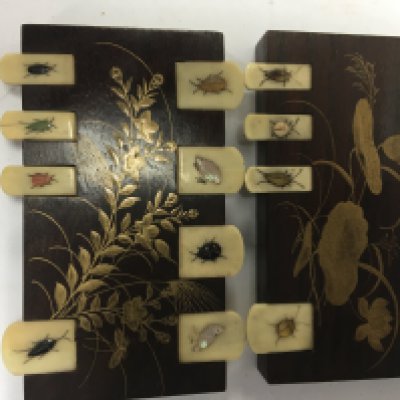 Two Japanese Shibyama game counters .