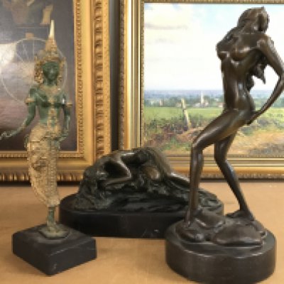 A bronze figure of a resting semi nude woman on a marble base by Portugese sculptor Miguel Fernando Lopez marked Milo (10cm tall 22cm long), a bronze figure of a nude woman posing and a deity figure. Postage category B