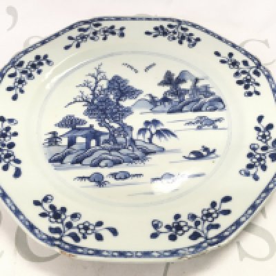An 18th century Chinese octagonal blue and white plate decorated with a river scene , 23cm wide. Chips seen on plate. This lot cannot be posted