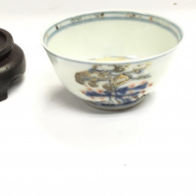 An Imari bamboo and pine tea bowl raised from the wreck of the Geldermalsen with COA.