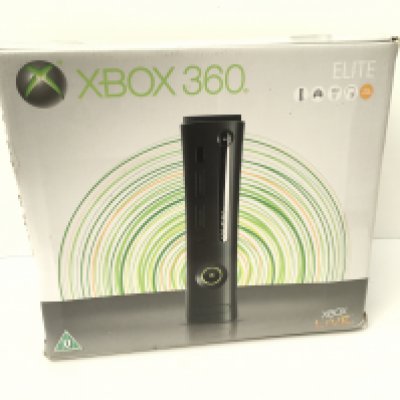 A boxed XBOX 360. Elite- includes power supply - manuals and various cables. No reserve