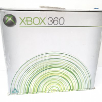 A boxed XBOX 360. Includes manuals and a cable. No reserve