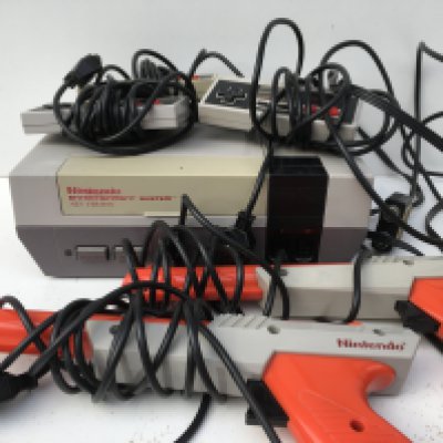 A Nintendo Entertainment System NES Version. Includes controllers..cables..2x Zappers. No reserve