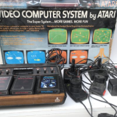 A Atari Video Computer System model CX-2600. Includes joysticks..paddles ..cables..power supply and 3 games cartridges. No reserve