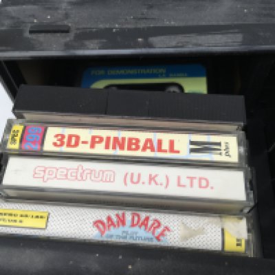 A drawered storage box containing 19 cassettes for use with a Sinclair computer. No reserve