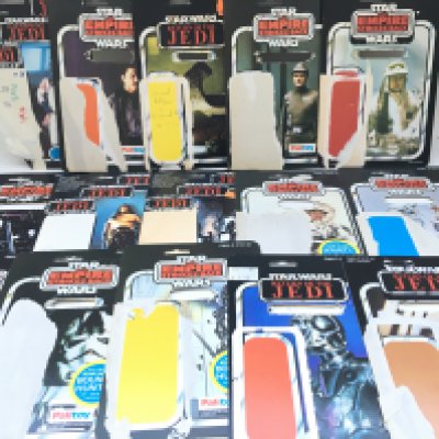 A Collection of Vintage Star Wars Backing Cards, figures and a Modern X-Wing.