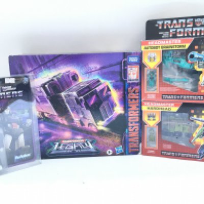 A Collection of Various Boxed And Loose Transformers.