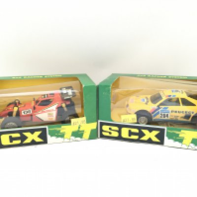 2 X Boxed SCX TT (Scalextric) Vehicles. A Stormrider Buggy And A Peugeot 405 Armardillo.