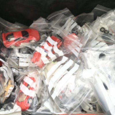 A Box Containing Sclalextric Cars And Spares.