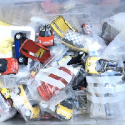 A Box Containing Scalextric Minis And Spares.