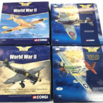 4 X Boxed Corgi Aviation Aircraft. A Junkers JU-87. A P51D Mustang. A Supermarine Spitfire And A Hawker Hurricane. 1/72 Scale No Reserve.