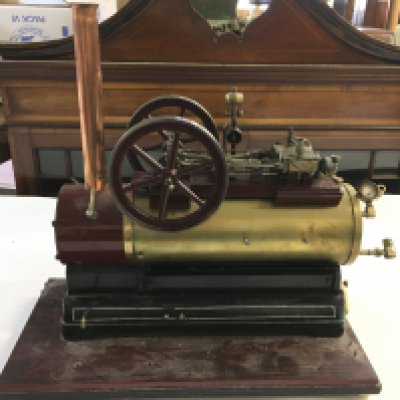 A Model Steam Boiler On Wooden Base. Approx Height 35Cm. Length 40Cm.