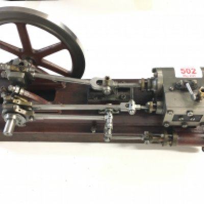 A Horizontal Model Steam Engine on Wooden Plinth. Approx Height 20Cm. Length 42 Cm.