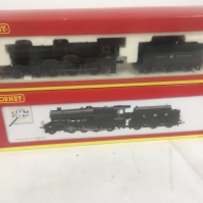2 x boxed 00 gauge model railway locomotives by Hornby including R2389 Builth Castle and R2394 class 8F. No reserve