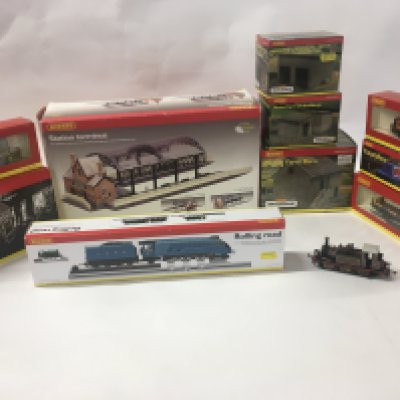 A collection of 00 gauge model railway items by Hornby including locomotives..wagons..buildings and a canal boat. R8211 R8746. R6120. R8602. R8610. R8609. R6153. R8009. No reserve