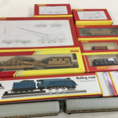 A collection of boxed and loose 00 gauge model railway by Hornby includes Coaches..Wagons..Accessories. No reserve.