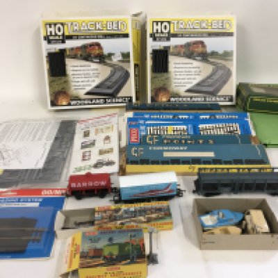 An assorted collection of OO gauge model railway pieces including wagons..points..scenery etc. no reserve