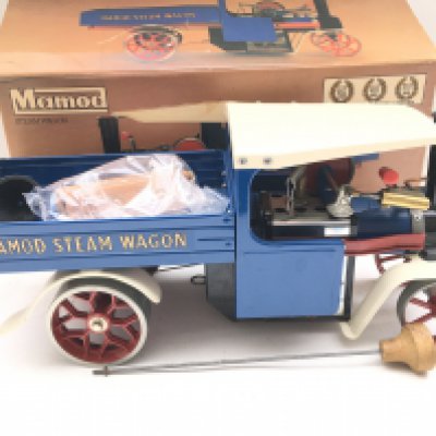 A Boxed Mamod Blue Steam Wagon #SW1 in Very Good Condition. With Original Accessories And Packaging. Has Been Fired.
