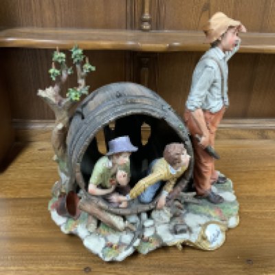 A Large Capodimonte Porcelain Sculpture title La Burla. (Posatge D, no postage avaliable in house)